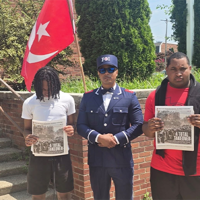 FOI Taseanby Karriem standing with guest who attended mosque service