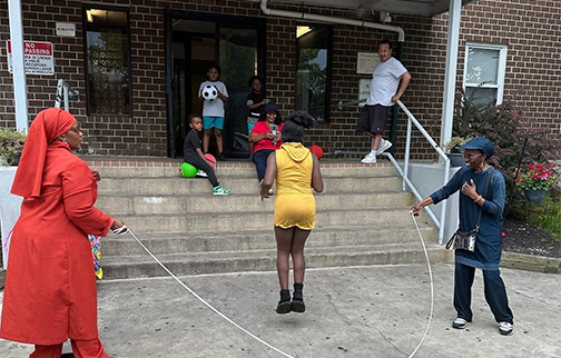 Chester, Pa MGT playing jump rope in community