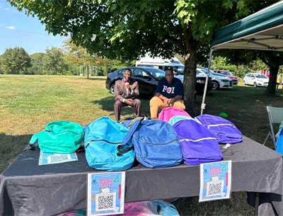FOI of Muhammad Mosque 102 attending bookbag giveaway