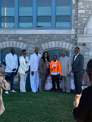 Student Minister Keith Muhammad standing with city officials in Chester, Pa
