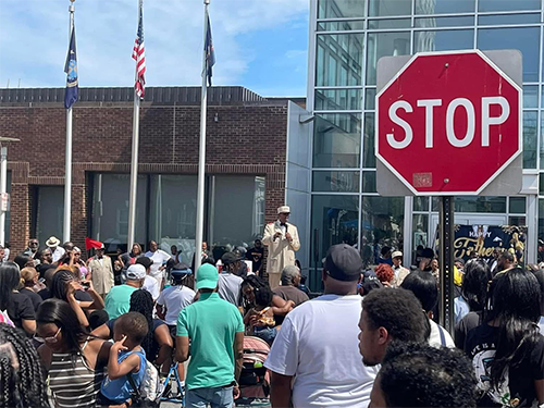 Bro. Keith Muhammad speaking in front of crowd at Chester City Hall
